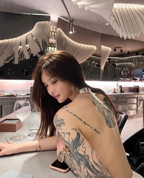 Dating in Thailand means taking tattooed women, like this one, out on a dinner date.